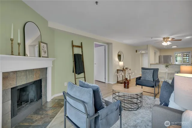 a living room with furniture and a fireplace