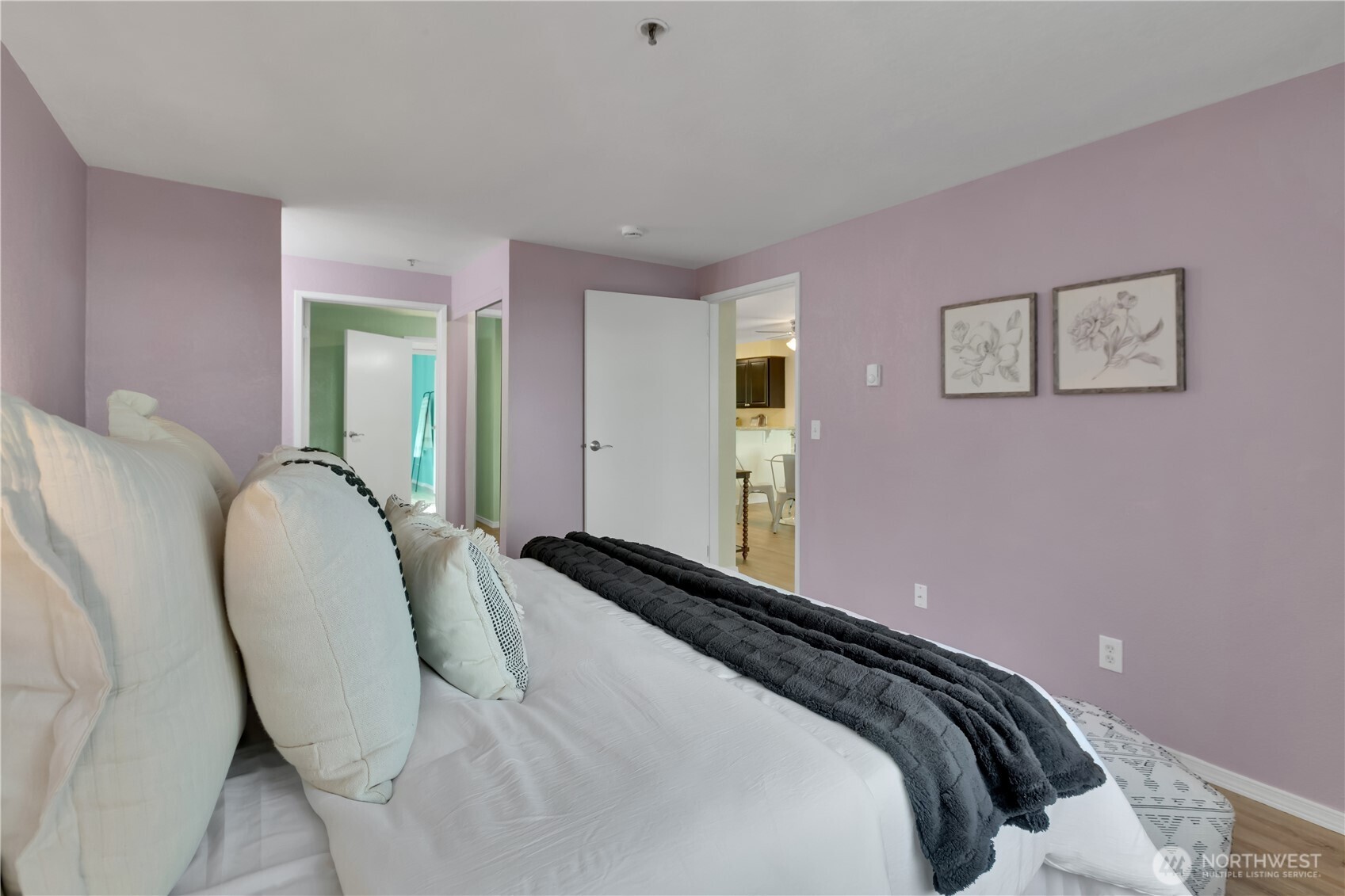 25035 98th Place South, Unit D102 Kent, WA 98030 - Photo 13 of 28 a bedroom with a bed and painting on the wall