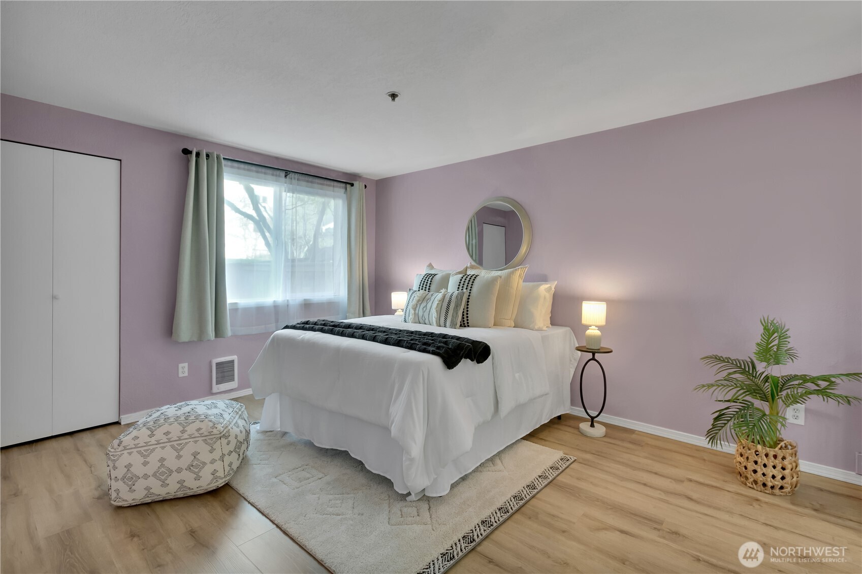 25035 98th Place South, Unit D102 Kent, WA 98030 - Photo 14 of 28 a bedroom with bed and a potted plant