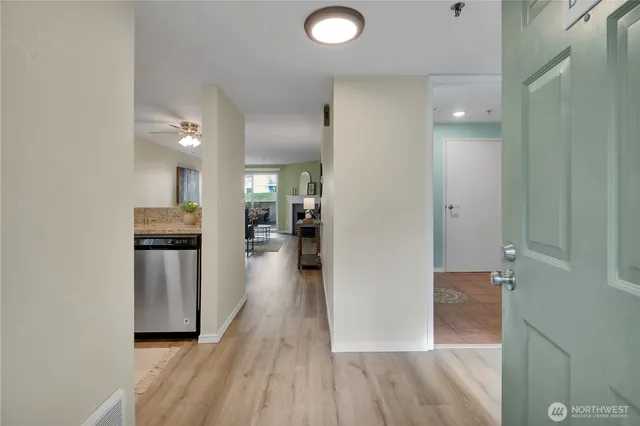 a view of a kitchen from the hallway