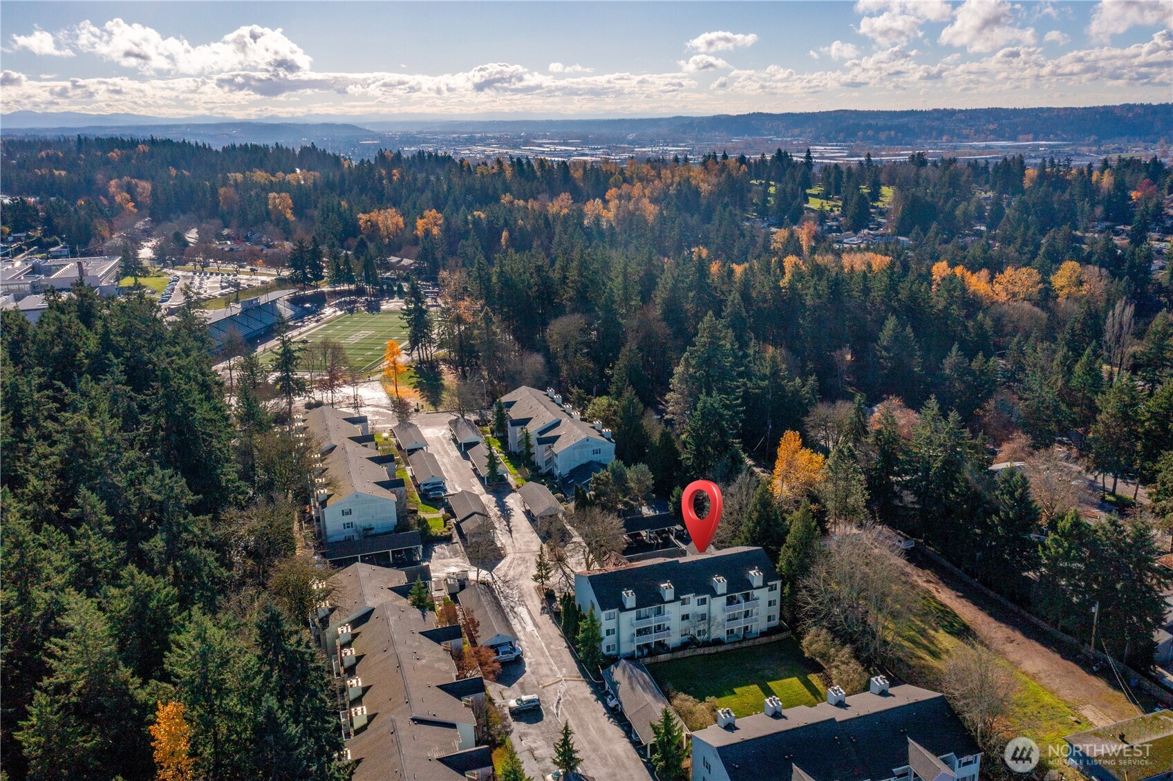 25035 98th Place South, Unit D102 Kent, WA 98030 - Photo 25 of 28 an outdoor view of a house with a lake view