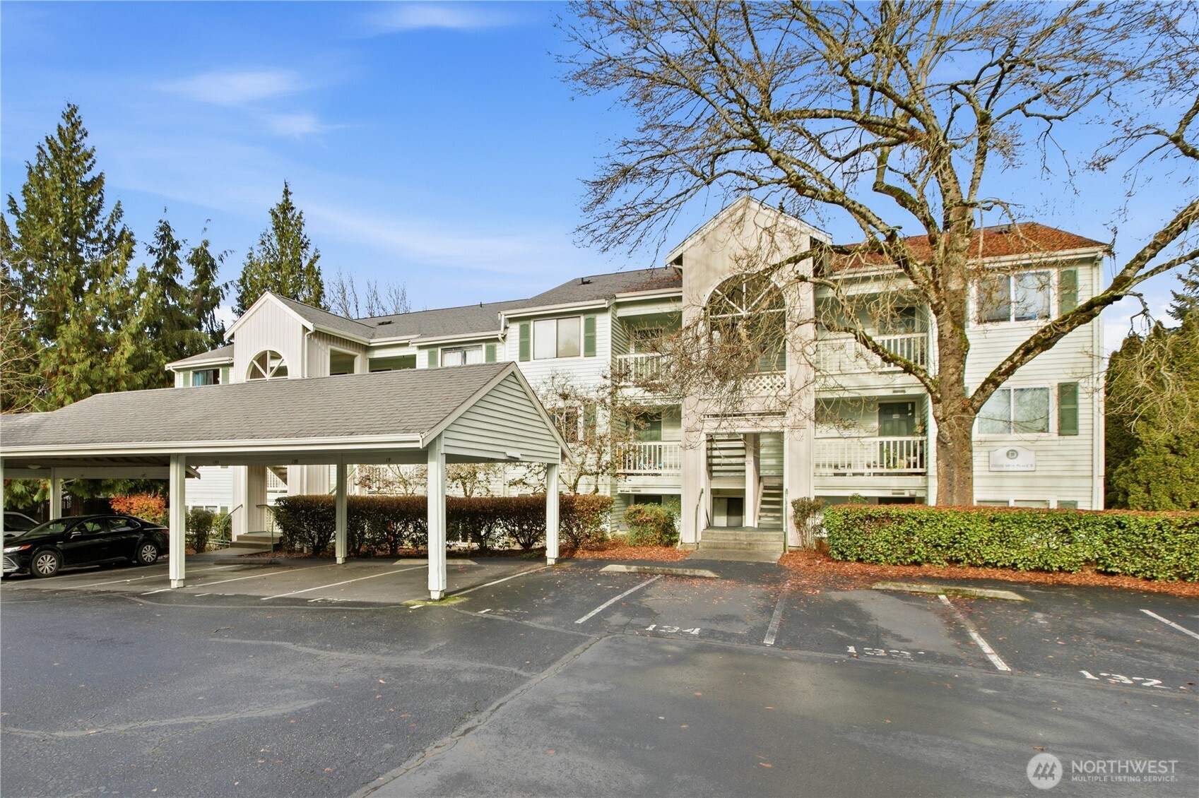 25035 98th Place South, Unit D102 Kent, WA 98030 - Photo 26 of 28 a front view of a house with a garden