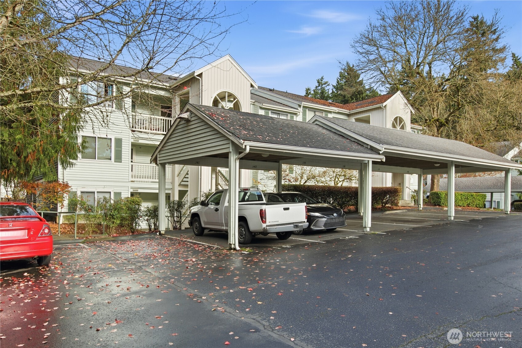 25035 98th Place South, Unit D102 Kent, WA 98030 - Photo 27 of 28 a view of a car park in front of a house