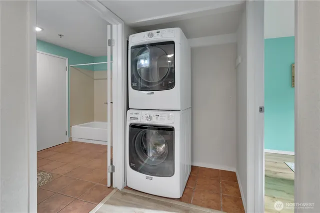 a living room with a washer and dryer