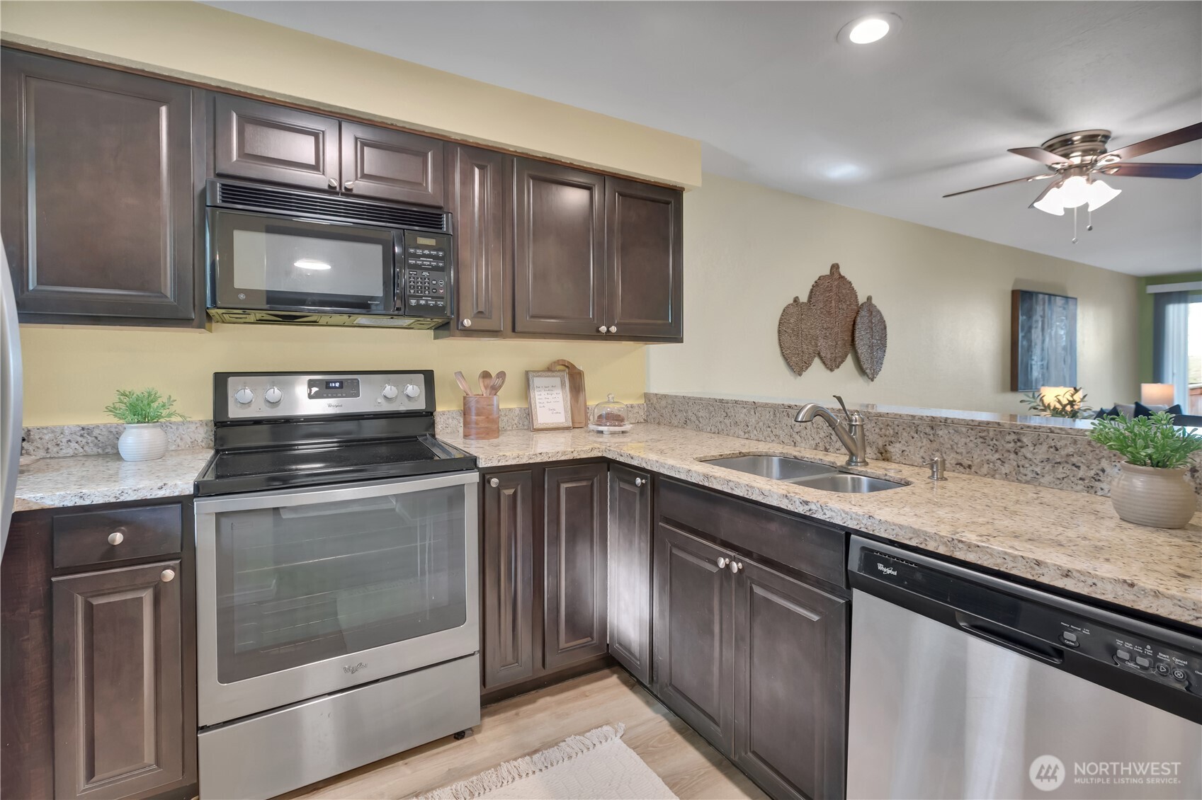 25035 98th Place South, Unit D102 Kent, WA 98030 - Photo 5 of 28 a kitchen with a sink stove and microwave