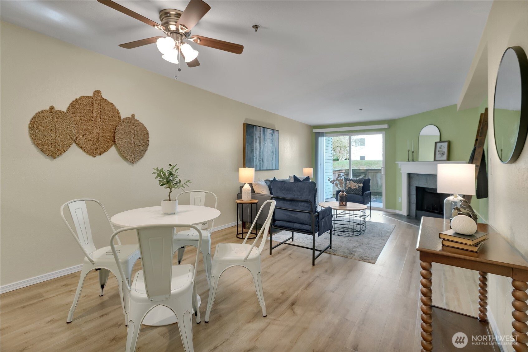 25035 98th Place South, Unit D102 Kent, WA 98030 - Photo 8 of 28 a view of a dining room with furniture and a fireplace