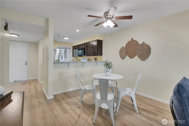 a view of a dining room with furniture and wooden floor