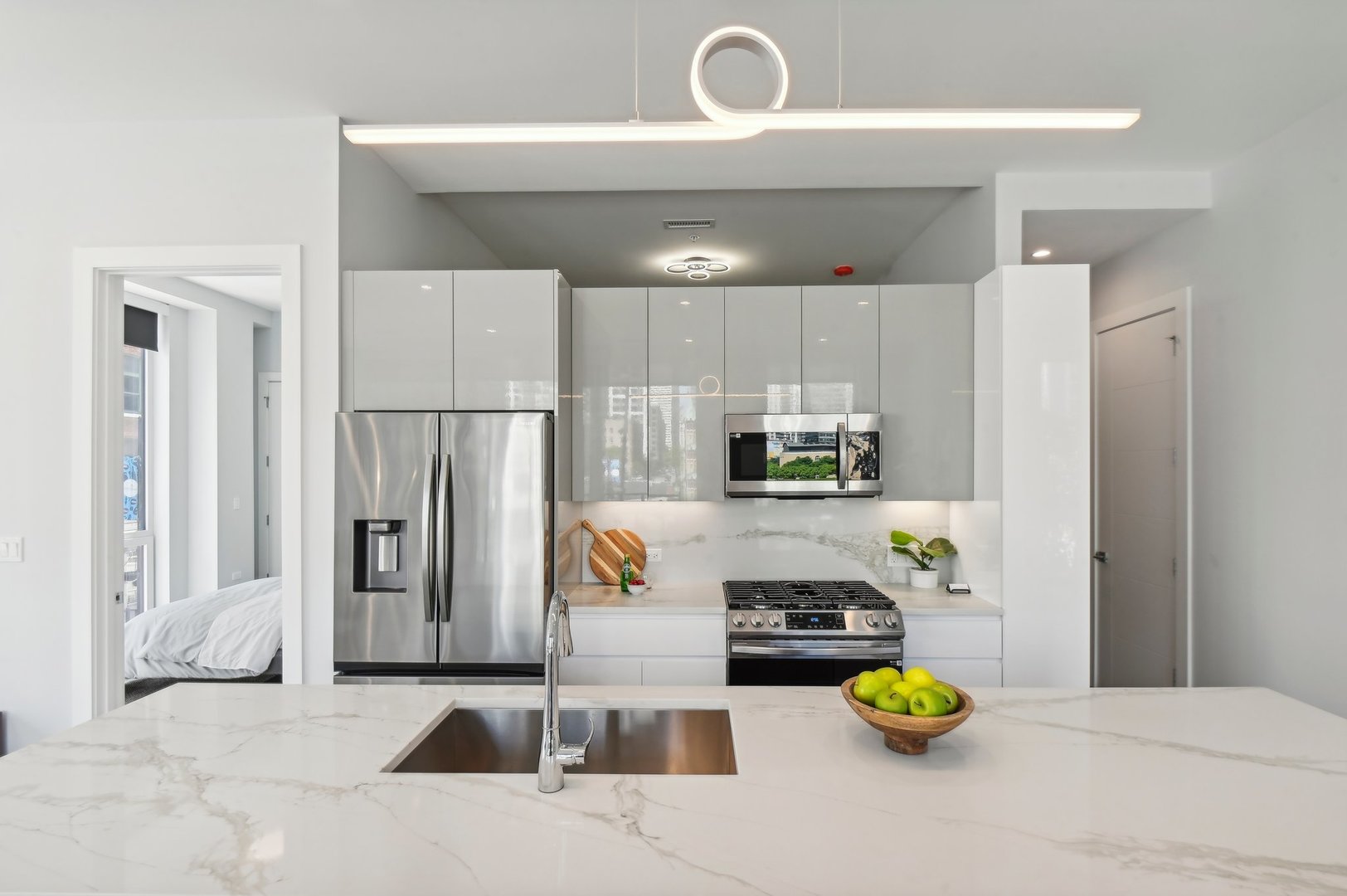 812 West Adams Street, Unit 613 Chicago, IL 60607 - Photo 12 of 32 a kitchen with a refrigerator and a stove top oven