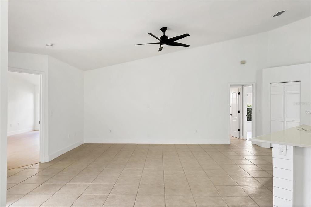 6409 Stone River Road Bradenton, FL 34203 - Photo 14 of 55 a view of empty room with wooden floor