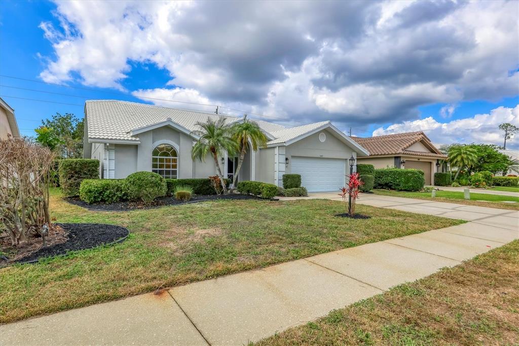 6409 Stone River Road Bradenton, FL 34203 - Photo 2 of 55 a front view of house with yard and green space