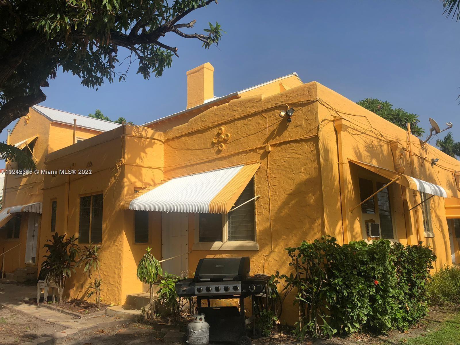 a view of a house with a street