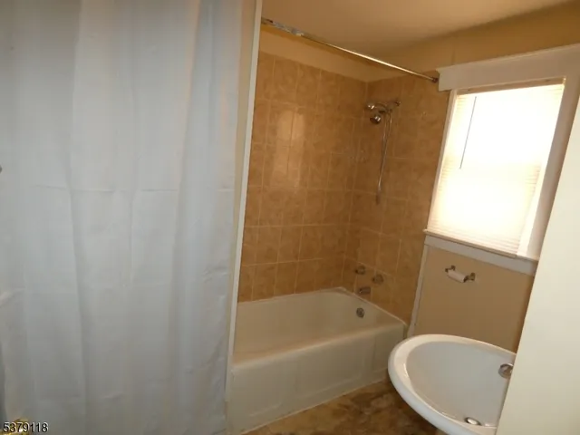 a bathroom with a toilet and a bathtub