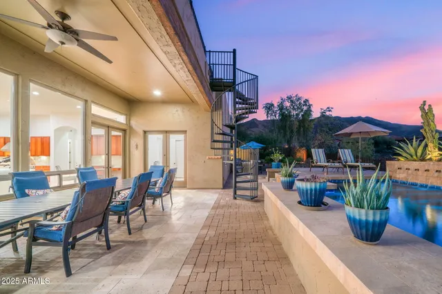 a kitchen with kitchen island granite countertop a table and chairs in it