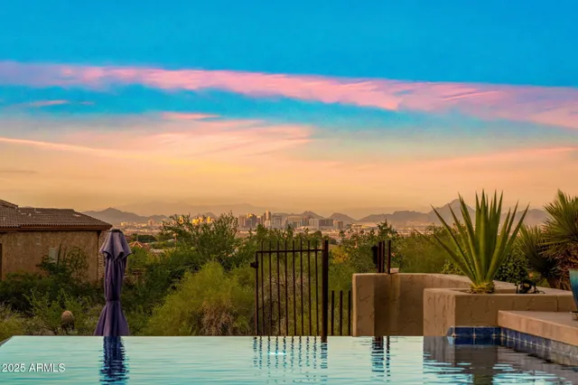 a kitchen with stainless steel appliances granite countertop a sink and a refrigerator