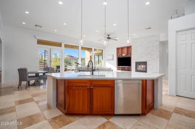 a view of a room with a furniture and a kitchen