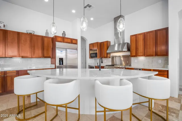 a spacious bathroom with a double vanity sink a mirror and a bathtub