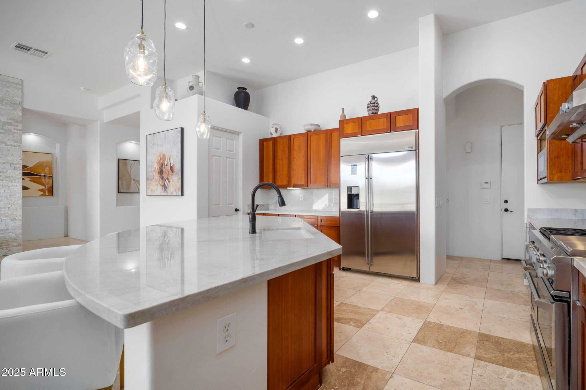 10302 South 16th Avenue Phoenix, AZ 85041 - Photo 25 of 74 a kitchen with stainless steel appliances granite countertop a sink and a refrigerator