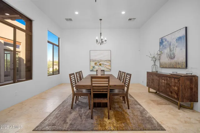 a view of a terrace with couches and sky view