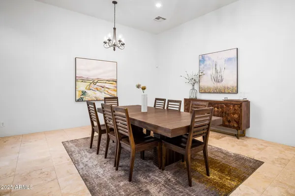 an aerial view of a house with swimming pool and lake view