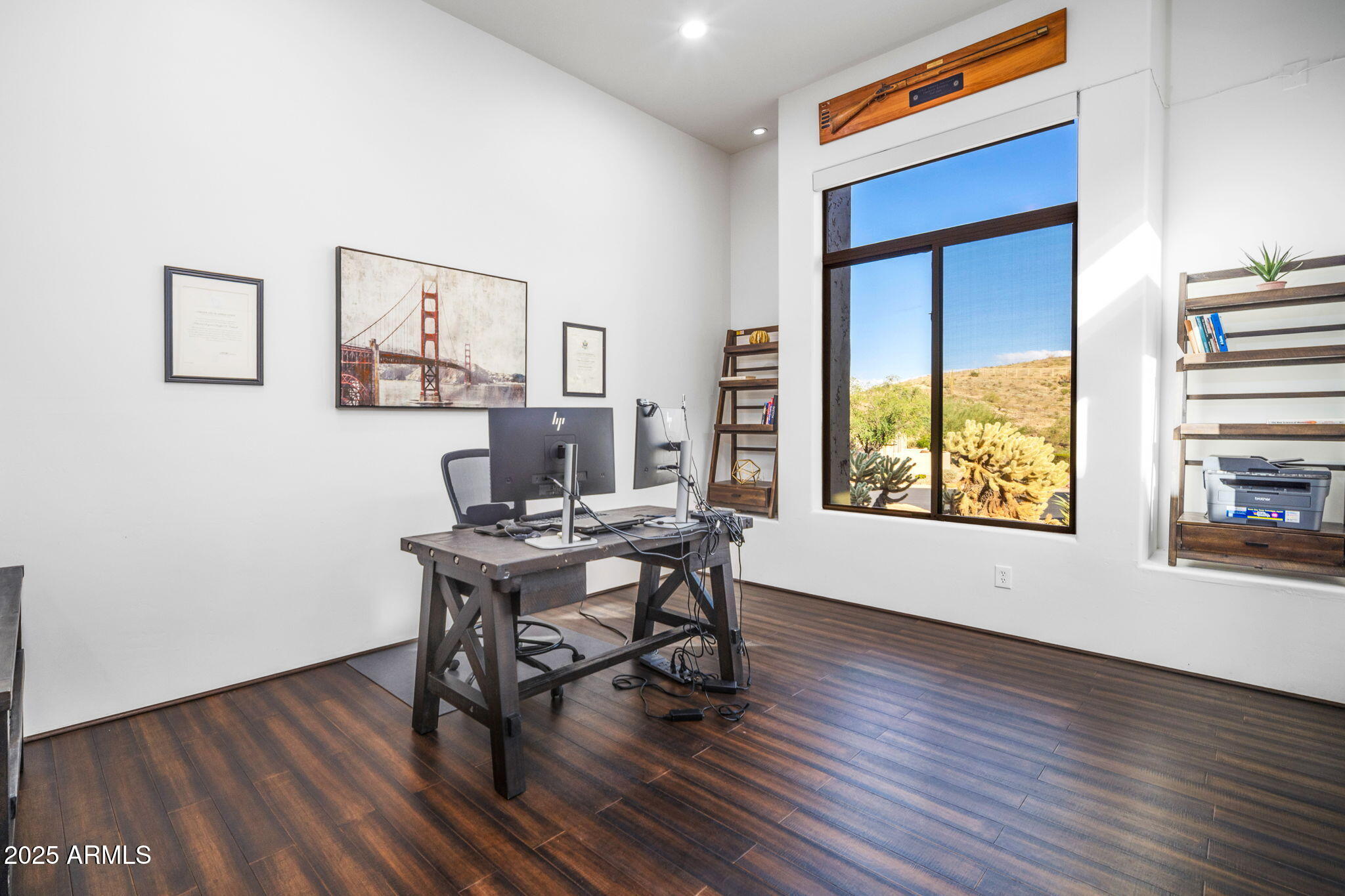 10302 South 16th Avenue Phoenix, AZ 85041 - Photo 31 of 74 a view of a workspace with furniture and a window