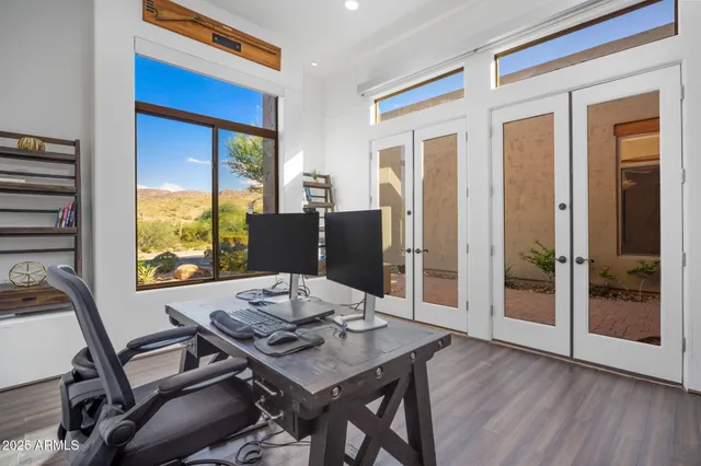 a terrace with outdoor seating and city view