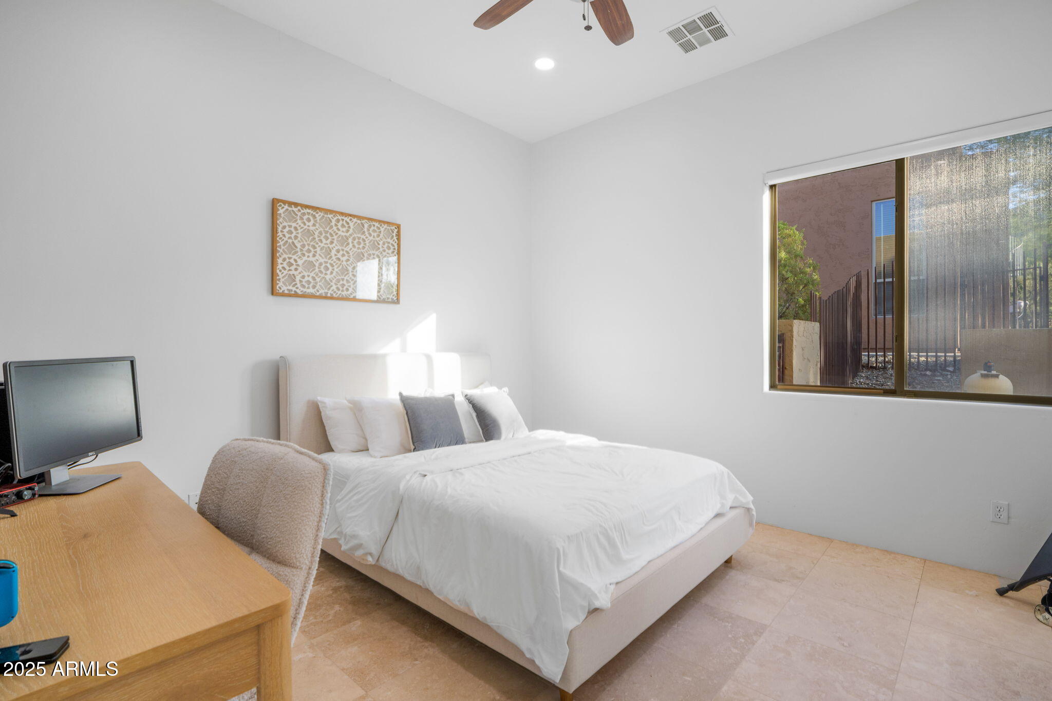 10302 South 16th Avenue Phoenix, AZ 85041 - Photo 37 of 74 a bedroom with a bed and a flat screen tv