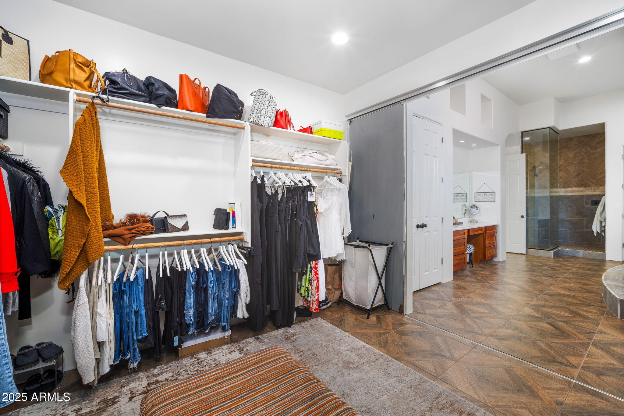 10302 South 16th Avenue Phoenix, AZ 85041 - Photo 50 of 74 a view of walk in closet with clothes and shoes