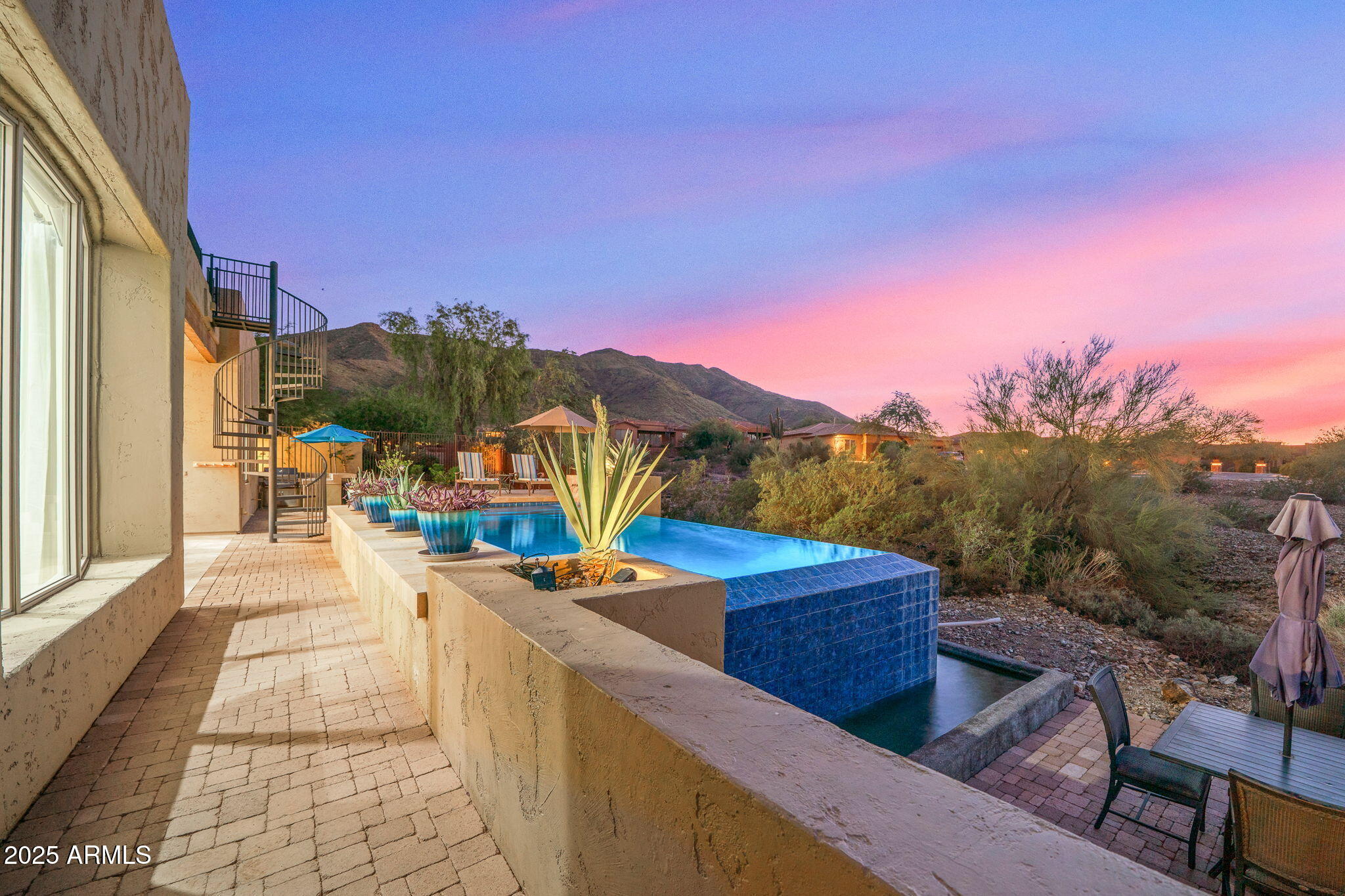 10302 South 16th Avenue Phoenix, AZ 85041 - Photo 59 of 74 a view of a terrace with couches and sky view