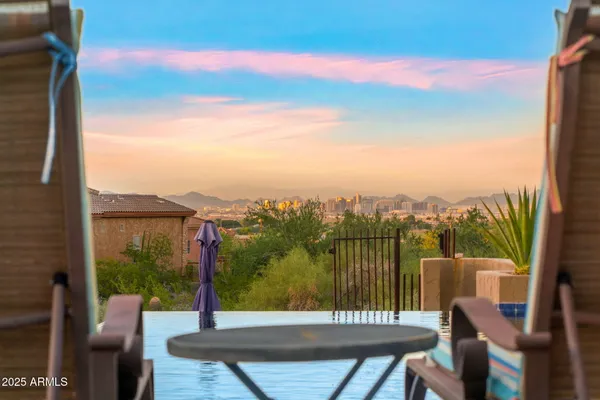 a view of a balcony with chairs