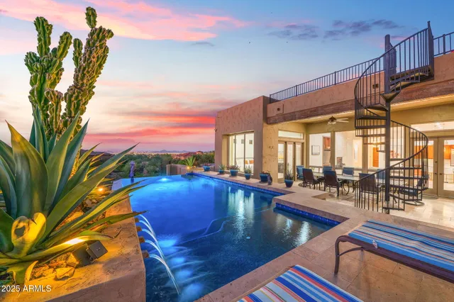 a view of a dining room with furniture and a window