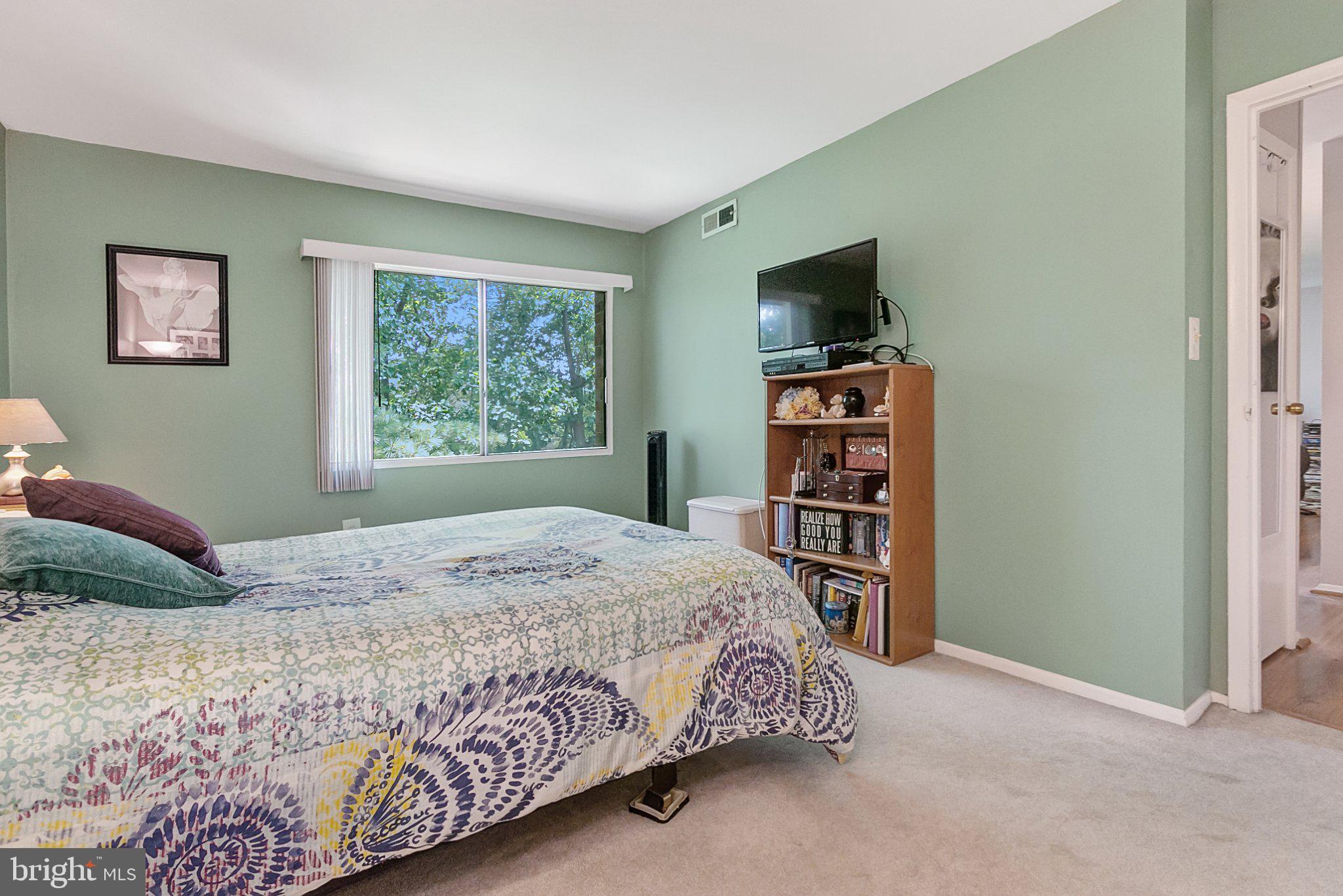 3750 Bel Pre Road, Unit 11 Silver Spring, MD 20906 - Photo 18 of 27 a bedroom with a bed and a window
