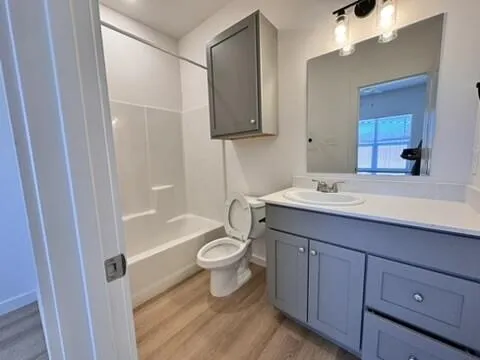a bathroom with a sink a toilet and bathtub