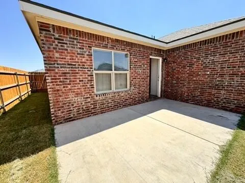 a view of house with backyard