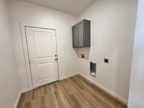 5711 Kemper Street, Unit B Lubbock, TX 79416 - Photo 7 of 20 a view of empty room with wooden floor