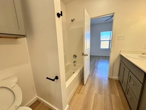 5711 Kemper Street, Unit B Lubbock, TX 79416 - Photo 8 of 20 a bathroom with a sink a toilet a shower and a mirror