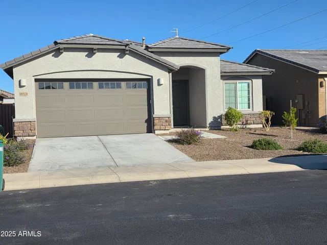 a front view of a house with yard