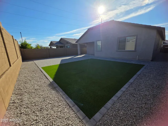 a backyard of a house with lots of green space
