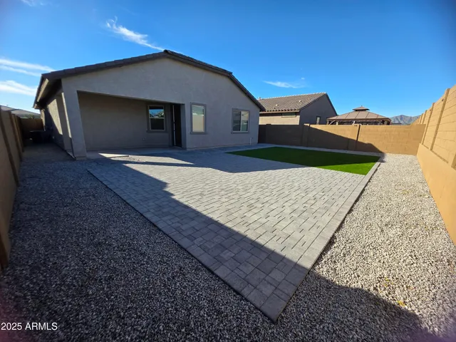 a house view with a backyard space