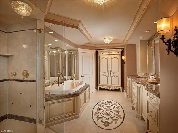 a spacious bathroom with a mirror a sink and a mirror