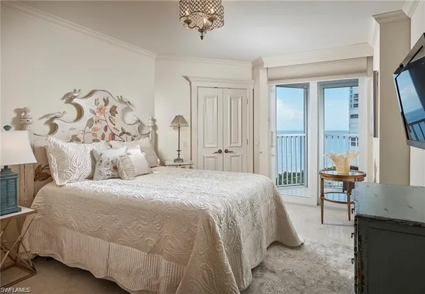 a bedroom with a bed and a table