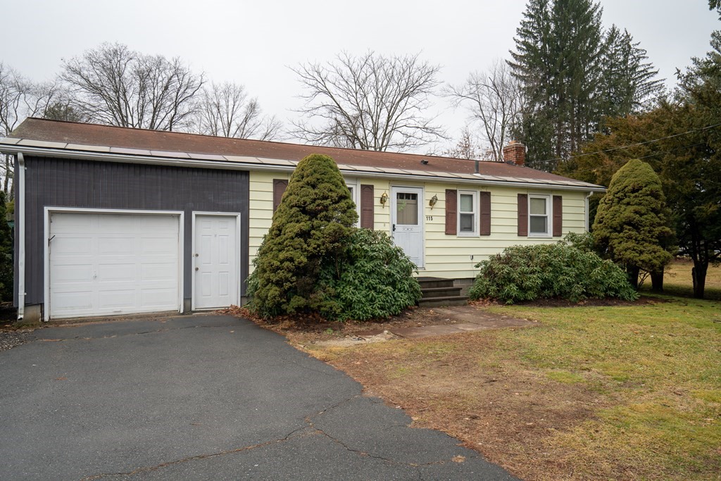 115 Belchertown Road Amherst, MA 01002 - Photo 1 of 18 front view of a house with a trees