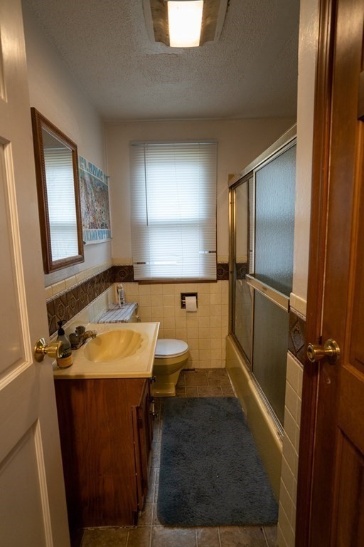 115 Belchertown Road Amherst, MA 01002 - Photo 11 of 18 a bathroom with a sink toilet and mirror