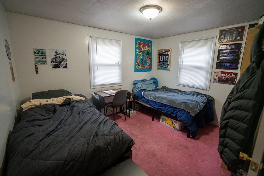 115 Belchertown Road Amherst, MA 01002 - Photo 12 of 18 a bedroom with a bed and a couch