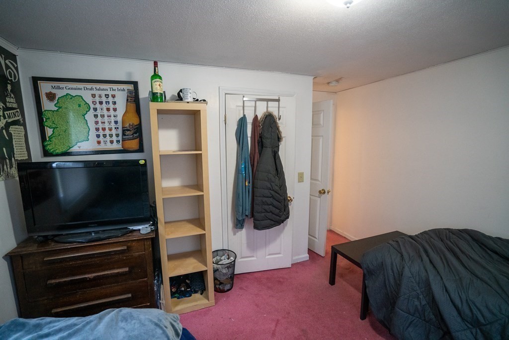 115 Belchertown Road Amherst, MA 01002 - Photo 13 of 18 a living room with furniture and a flat screen tv