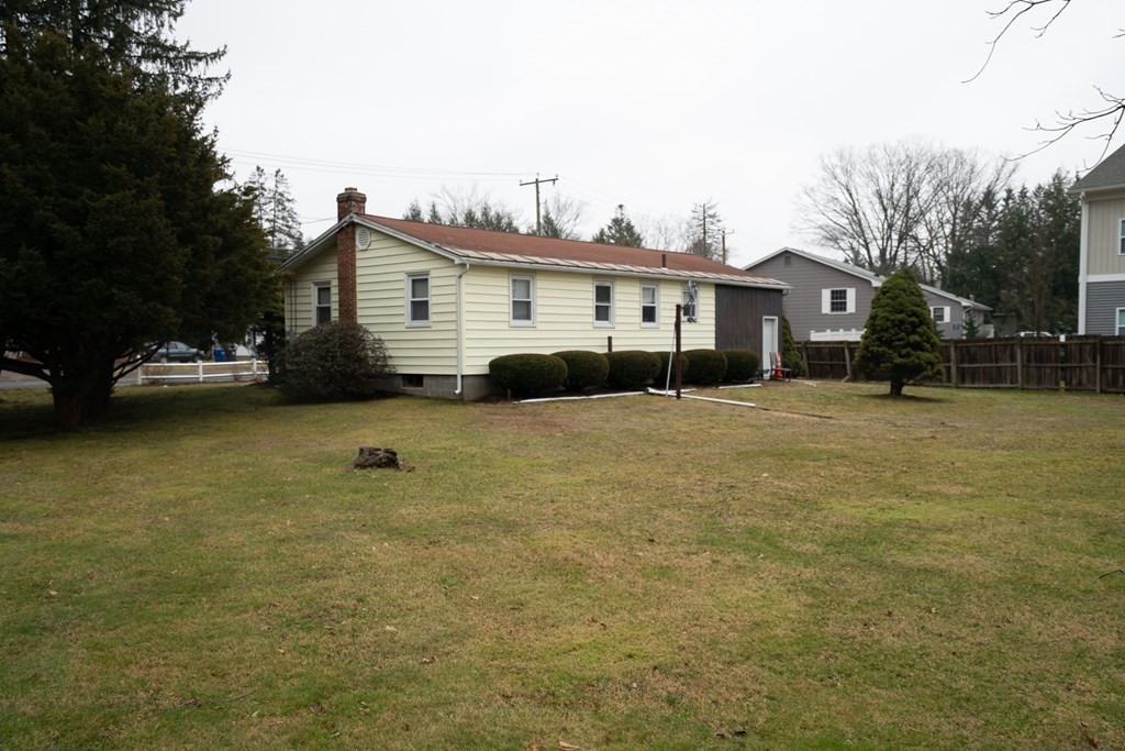 115 Belchertown Road Amherst, MA 01002 - Photo 17 of 18 a view of a house with a yard and sitting area