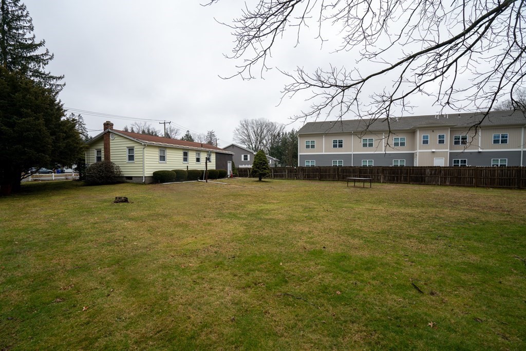 115 Belchertown Road Amherst, MA 01002 - Photo 18 of 18 a view of a yard with plants and large trees