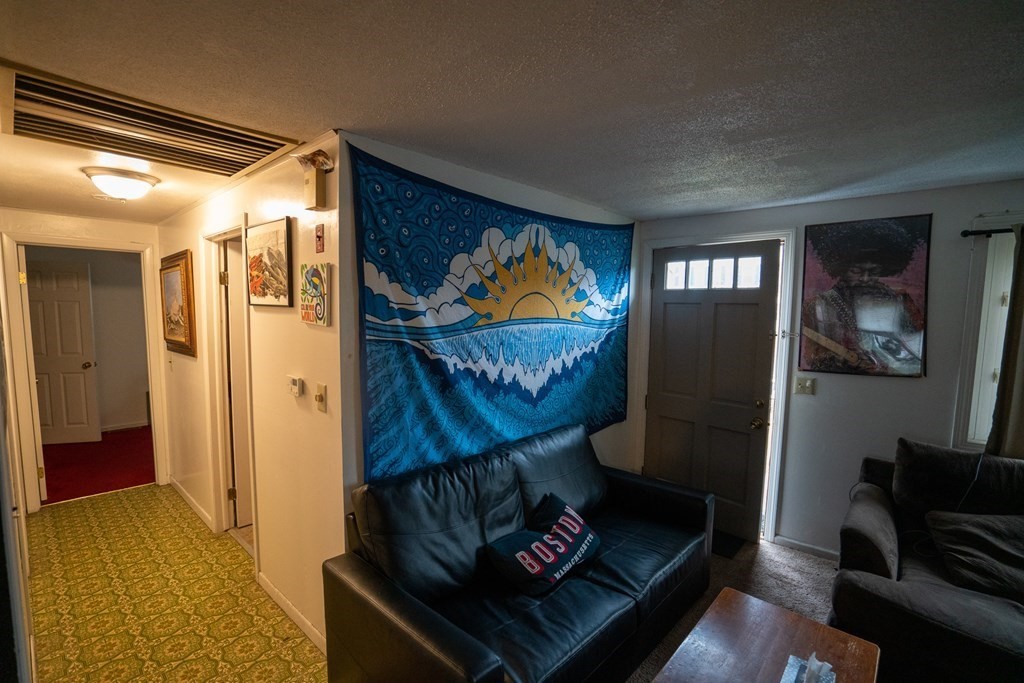 115 Belchertown Road Amherst, MA 01002 - Photo 5 of 18 a living room with furniture and a window