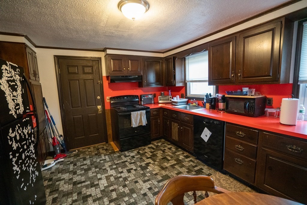 115 Belchertown Road Amherst, MA 01002 - Photo 6 of 18 a kitchen with stainless steel appliances kitchen island granite countertop a sink stove and cabinets