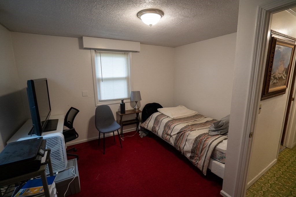 115 Belchertown Road Amherst, MA 01002 - Photo 9 of 18 a bedroom with bed and a window
