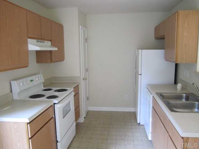 4360 Haverty Drive Raleigh, NC 27610 - Photo 3 of 9 a kitchen that has a sink and a stove